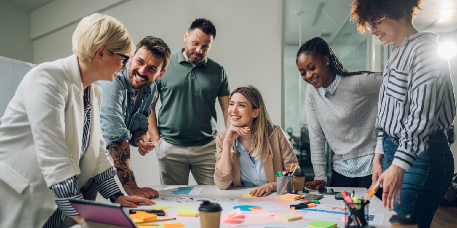 a group of professionals talking over a table about project management